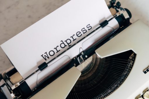 The word Wordpress is typed on a typewriter. Use for the header image for the article 'What is WordPress'